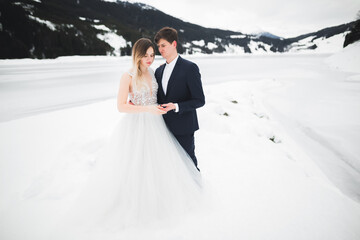 Loving husband and woman on the background of the mountains. Loving couple emotionally spends time