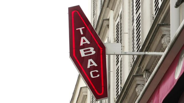 Tabac sign on shop exterior. This store sells cigarettes and tobacco in Paris, France. Stock Video Clip Footage