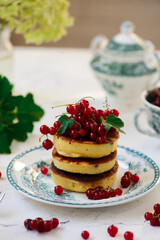 pancakes with red currant..style  .selective focus