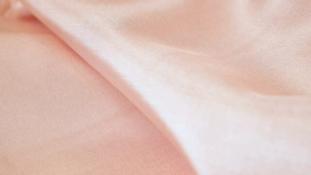 Light fabric texture,  waving bedding sheets background, silk fabric background