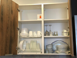 cupboard in the kitchen - plates, mugs, glasses
