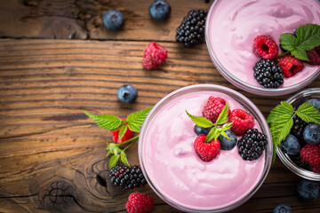 Fresh berry fruit yogurt with forest fruits and mint