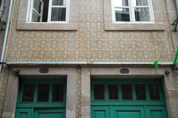 Retro and vintage orange and blue tile facade of a typical residential building in Porto Portugal Europe 