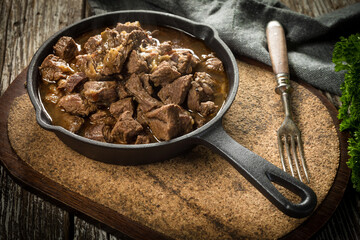 Beef stew in a cast iron skillet.