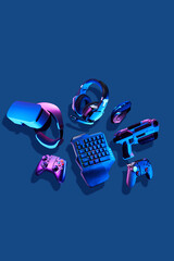 Virtual reality gogles, gamepads and blaster game controllers, games keyboard, mouse and headset. © nuclear_lily