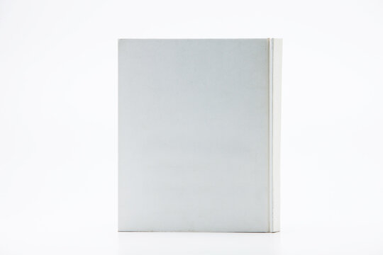 White Book With No Title Standing On White Background