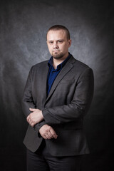 a young man businessman on a plain background.