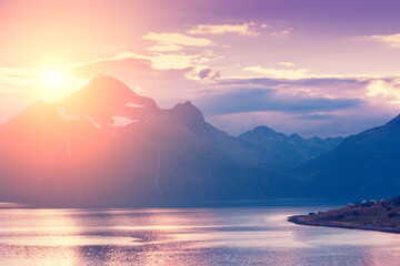 Fjord at sunset. Rocky seashore in the evening.  Beautiful nature of Norway. Picturesque Scandinavian landscape. Lofoten islands, Norway