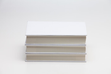 Pile Stacked white blank books on white background