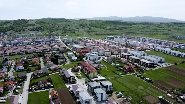 Aerial shot of a small town on the outskirts of Cluj, Romania. Gilau