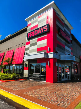 Orlando, USA - May 8, 2018: TGI Fridays exterior and logo. TGI Friday's is an American restaurant chain focusing on casual dining.
