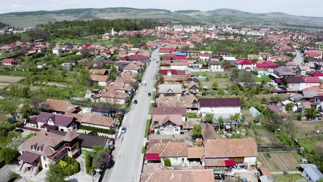 Aerial shot of a small town on the outskirts of Cluj, Romania. Gilau