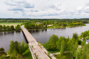 Fototapeta premium Aerial panoramic view of bridge in city Inkeroinen at river Kymijoki, Finland.