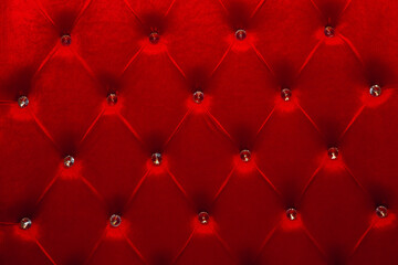 red texture of velour carriage screed upholstery fabric for furniture.