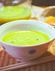 Closeup of Japanese traditional green tea with milk called Matcha Latte on the table. Super food. Diet meal. Healthy breakfast. World tea collection.