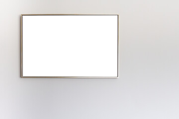 Thin picture frame on a gray wall. Isolated. Place for text or picture. High quality photo