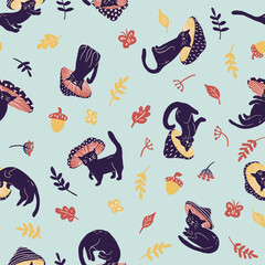 Black cat in mushroom costume with leaves seamless pattern on cyan background for halloween in childish style. Texture for kids fabric, wrapping, textile, wallpaper, apparel. 