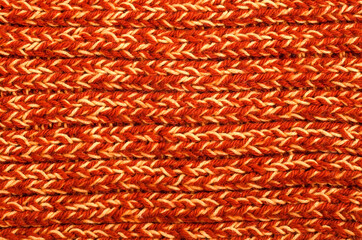 Bright orange and yellow knitted textured background. Winter christmas background