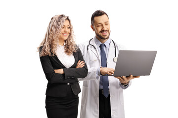 Fototapeta premium Businesswoman and a male doctor looking at a laptop computer