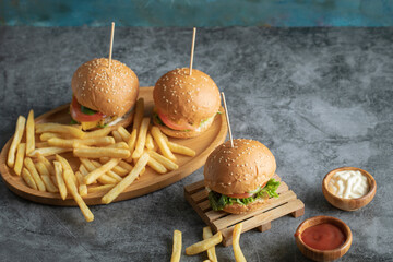 Fast food menu with burgers and fried potatoes