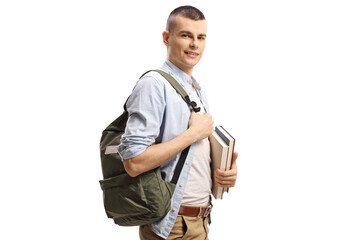 Male college student carrying books