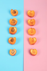 Apricots isolatted on pink and blue wallpapers