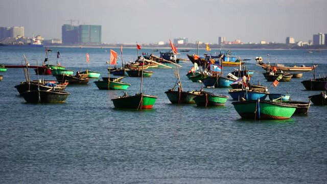 Vietnamese traditional round woven bamboo boats on open sea near city Danang, Vietnam. It is also called Thung Chai