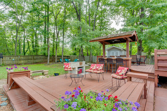 Garden deck patio wood oasis outdoor furniture red pattern relax backyard deck forest greenery bar 