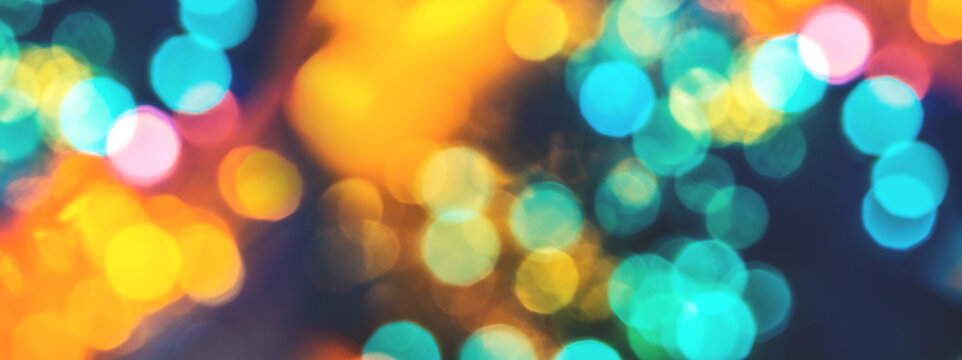 Colorful background with natural bokeh texture and defocused sparkling lights. Teal and orange blur with background with twinkling lights. Festive lights overlay or web banner with copy space - Powered by Adobe