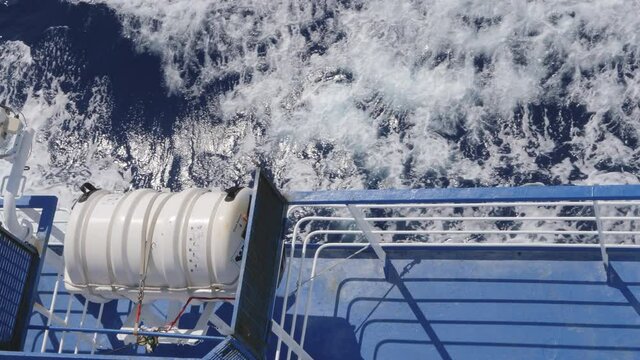 View of the upper deck of the ferry sailing to reach Sardinia. Especially the lifeboat and life rafts