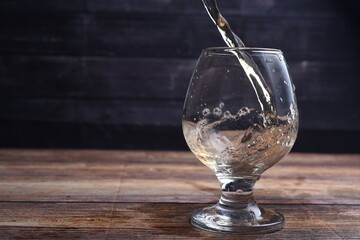 pouring water into glass