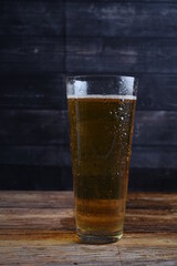 glass of beer on wooden table