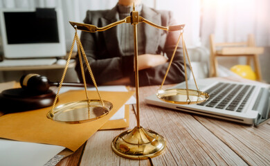 justice and law concept.Male judge in a courtroom on wooden table and Counselor or Male lawyer...