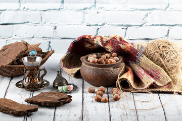 Chocolate pieces with nuts and a glass of tea