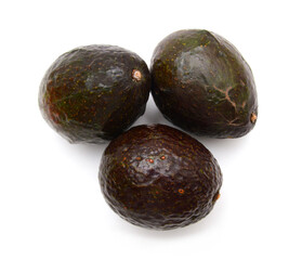 Whole and half avocado isolated on white.