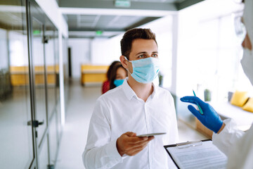 Visitors must go through fever measures using infrared digital thermometer check temperature...