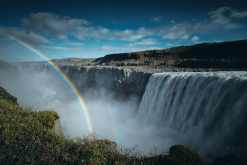 Rainbow at Dettifoss waterfall in Northeast Iceland. Beautiful nature icelandic landscape, long exposure effect