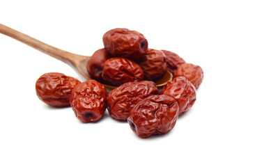 Red date and wooden spoon on white background