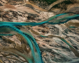 Aerial drone view of melting glacier river water in South Iceland. Abstract nature background