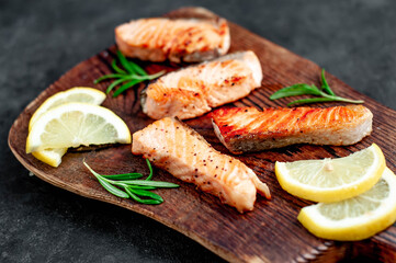
grilled salmon slices on stone background