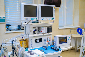 Artificial lung ventilation monitor in the intensive care unit. Nurse with medical equipment. Ventilation of the lungs with oxygen. COVID-19 and coronavirus identification. Pandemic.