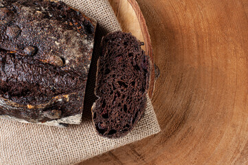 .Italian cocoa bread - Natural fermentation. Wood background. Top view. Copy space