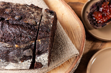 ..Italian cocoa bread with red fruits   - Natural fermentation. Wood background.  Selective focus