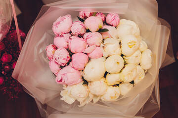 Bunch of beautiful pink roses with gol.den bokeh for mothers day close up.