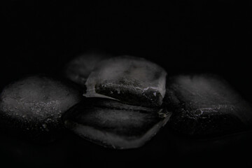 Ice cubes on a black background