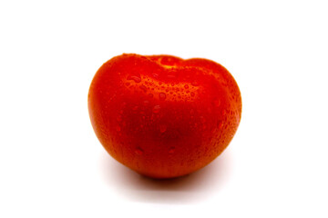 Red tomato with drops of water
