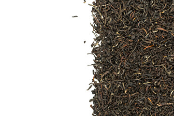 Leaves of black premium dry tea on a white background