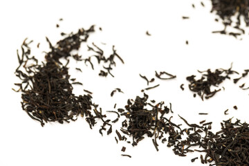 Leaves of black premium dry tea on a white background
