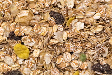 oatmeal with raisins, coconut, pineapple and banana slices isolated on a white background. For packing oatmeal or granola.