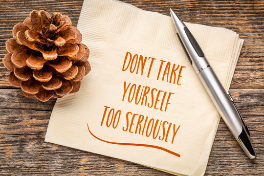 Do not take yourself too seriously - handwriting on a napkin, mindset and attitude concept